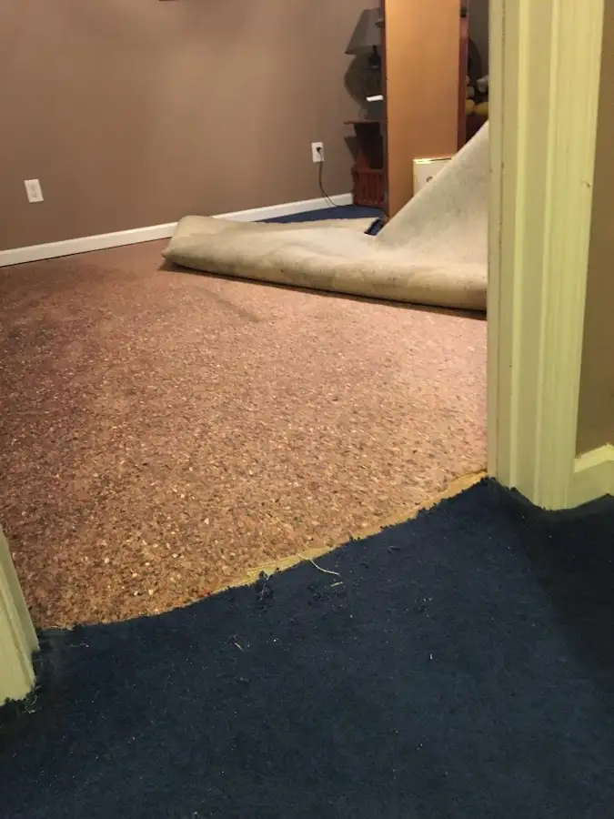 Carpet pad removal revealing water damage during Drying & Dehumidification in Longview